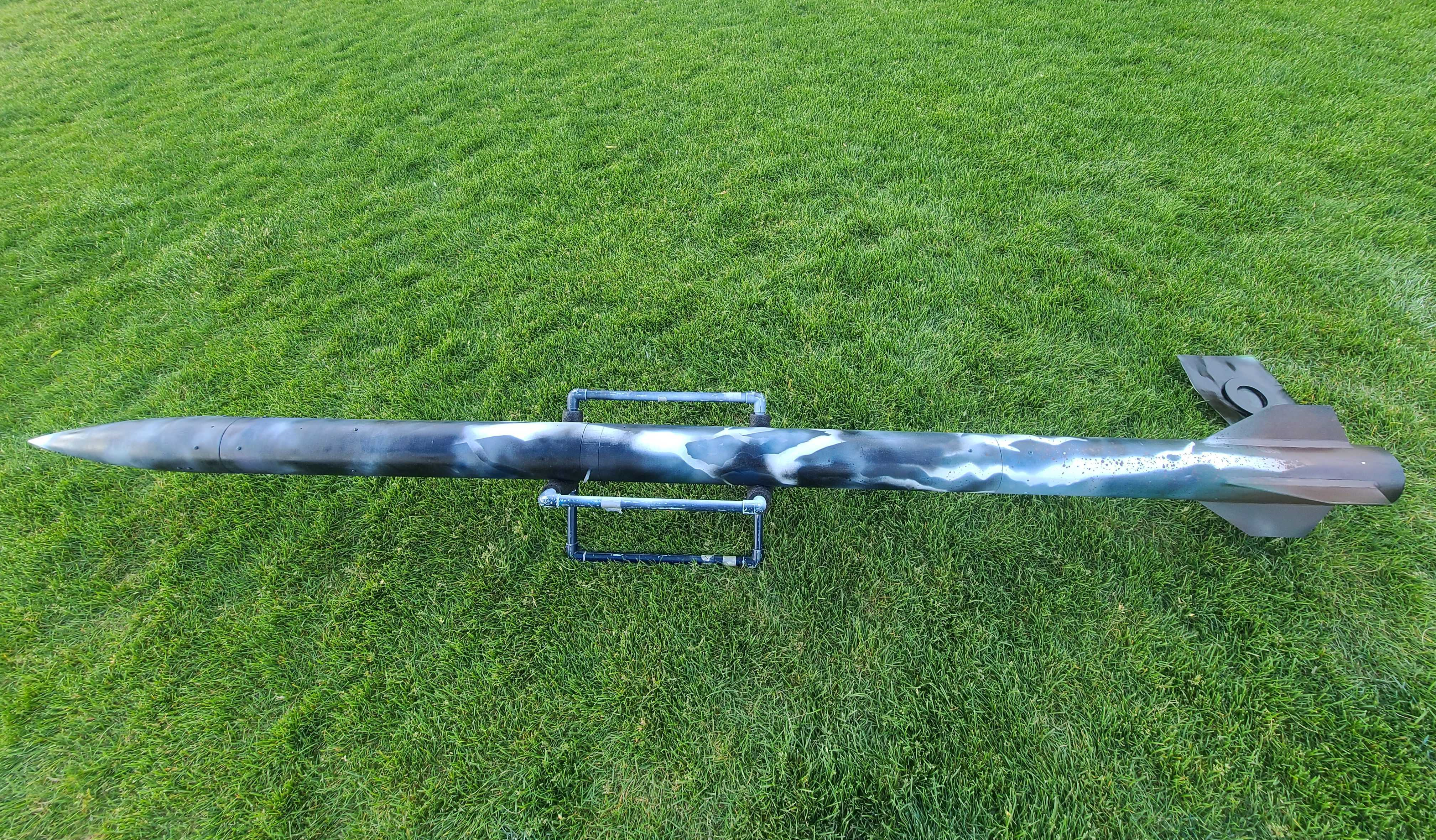 BYU Rocketry's Category V hybrid rocket on the launch pad with the water ballast payload integrated inside.